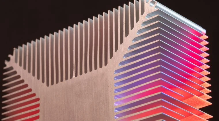 Abstract view of an aluminum heat sink with colorful lighting, showcasing modern technology
