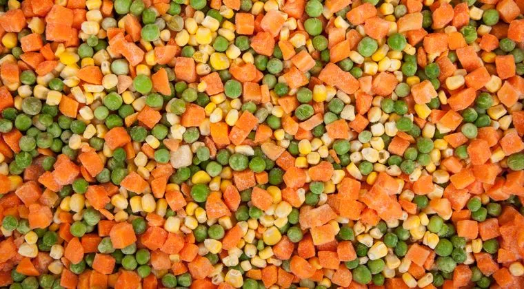 A vibrant mix of frozen carrots, peas, and corn showcasing healthy eating options
